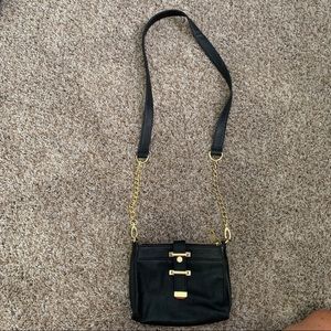 Black satchel with gold hardware